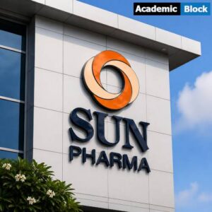 Modern Sun Pharma building facade with orange circular logo and “SUN PHARMA” signage on a clean white exterior under a blue sky.