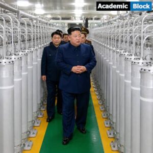 Kim Jong Un speaks with officials while inspecting a uranium enrichment facility in North Korea.