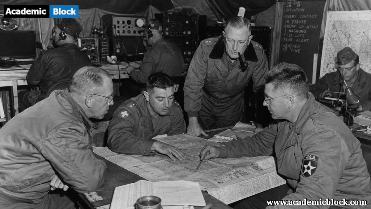 Officers and radio operators coordinate military strategy inside a Korean War command post, studying battlefield maps amid a tense wartime atmosphere.