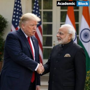 Donald Trump and Narendra Modi shake hands during a diplomatic meeting, with U.S. and Indian flags displayed in the background.