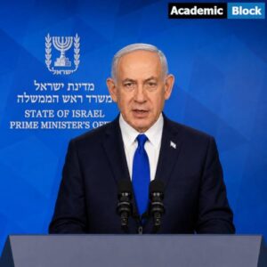 Netanyahu delivers a formal address from a podium, standing before a blue backdrop displaying the State of Israel Prime Minister’s Office emblem and text.