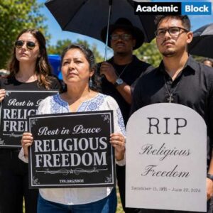 The image shows demonstrators holding funeral-themed protest signs and tombstone replicas outside the Barbara Jordan State Office Building in Austin, Texas.