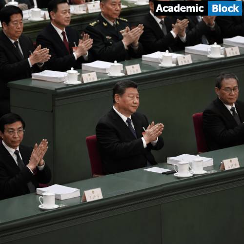 Image showing President Xi seated at a government meeting expected to pass a law restricting the rights of ethnic minorities with officials applauding during a policy session.