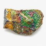 A vibrant rare earth mineral specimen with colorful, shimmering deposits embedded in a rugged rock matrix.