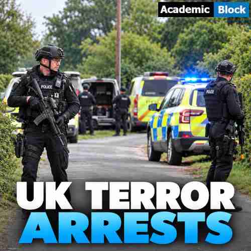 Image showing UK police officers secure a road near RAF Fairford during a major security operation following the arrest of five men on terrorism suspicions.